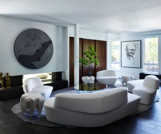 White curved sofas and chairs, wooden panelled walls, black fireplace