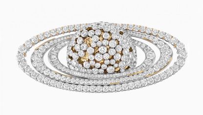A Van Cleef & Arpels Saturn brooch in gold with diamonds