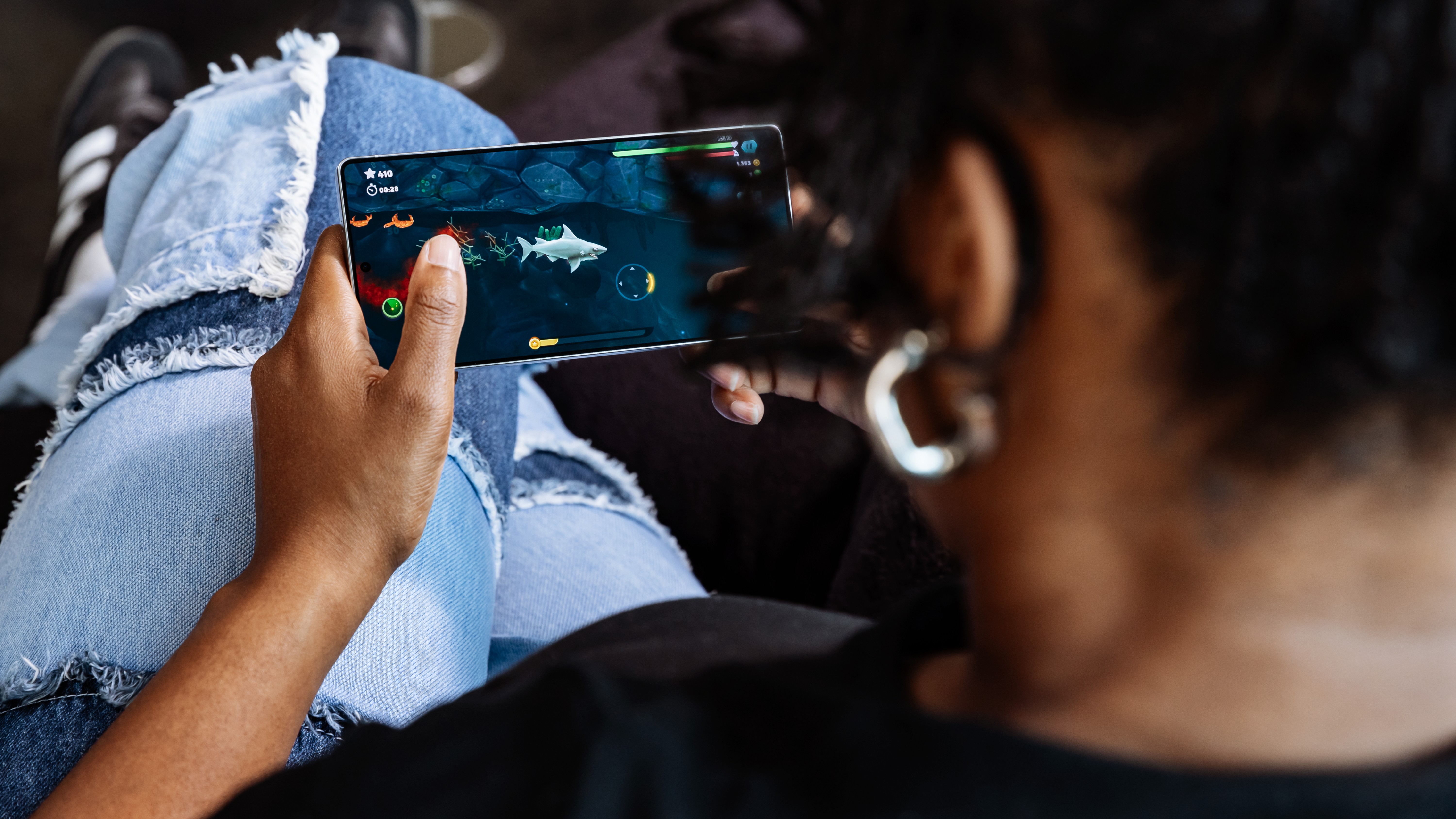Person playing a game on Samsung Galaxy S25