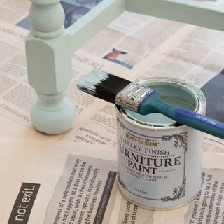 Paint brush on top of paint pot