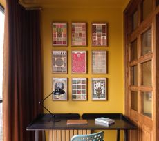A small study room with color drenched walls and ceiling