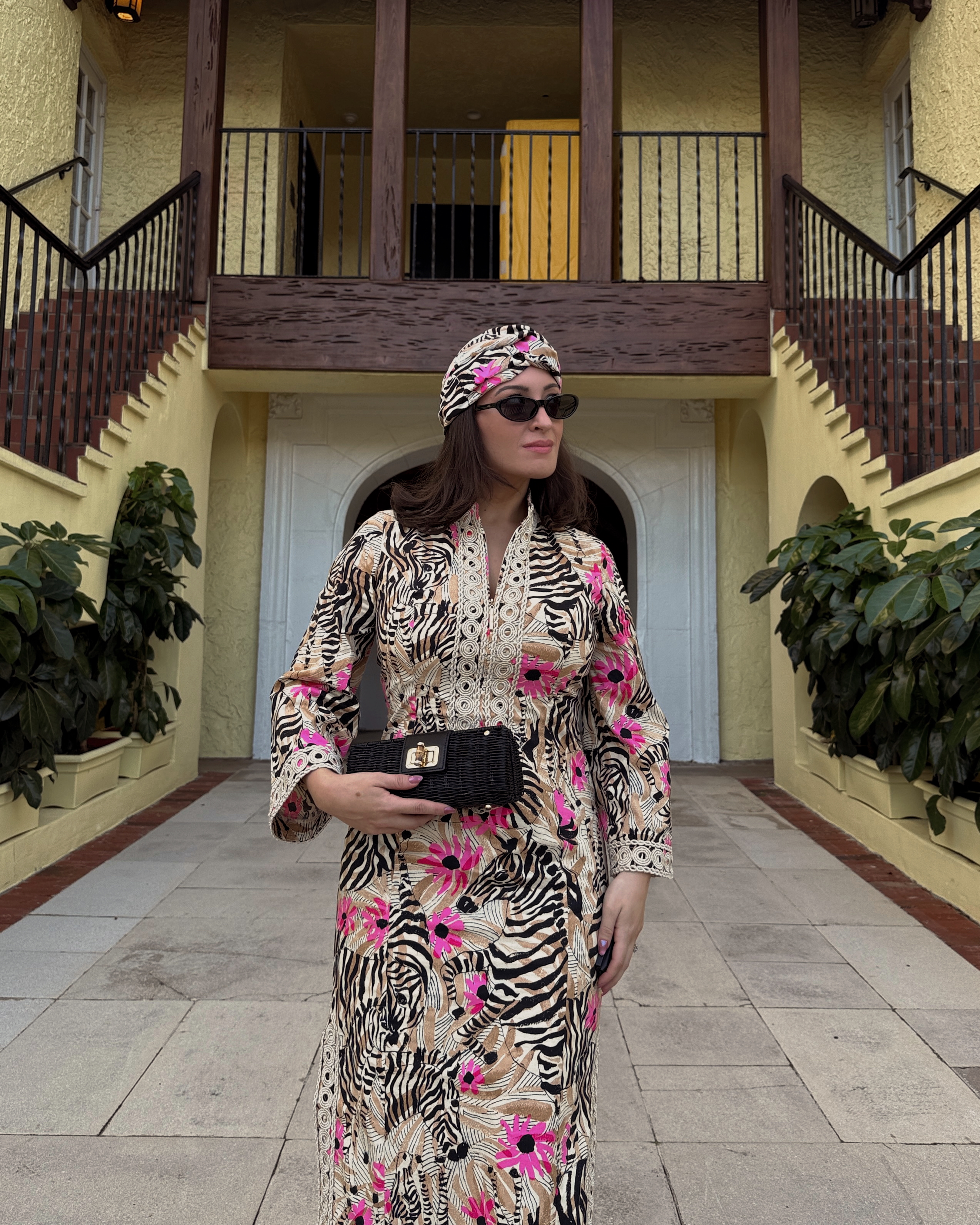 Bella Gerard wearing a snowbird inspired printed caftan while on vacation in Florida