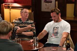 Martin Fowler sitting next to Ian Beale in the Queen Vic