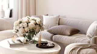cream sofa with marble coffee table