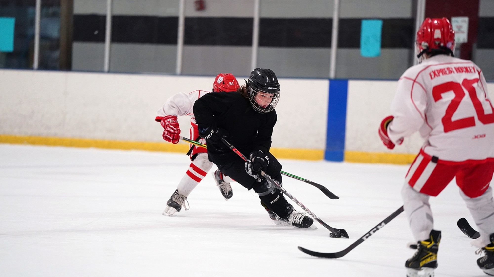 Kids play during an ice hockey scrimmage in Brewster, New York. 