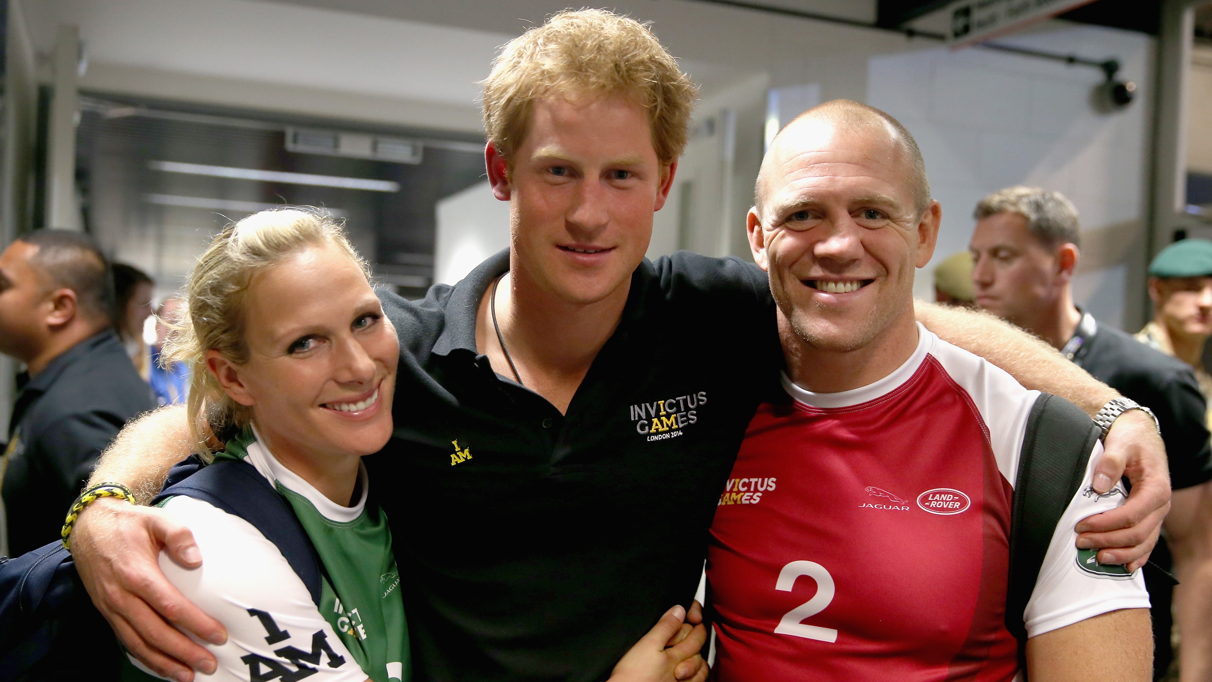 Prince Harry, Zara and Mike Tindall pose for a photograph after competing in an Exhibition wheelchair rugby match