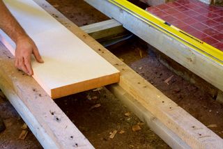 Kingspan Kooltherm K3 is fitted between timbers in a suspended floor