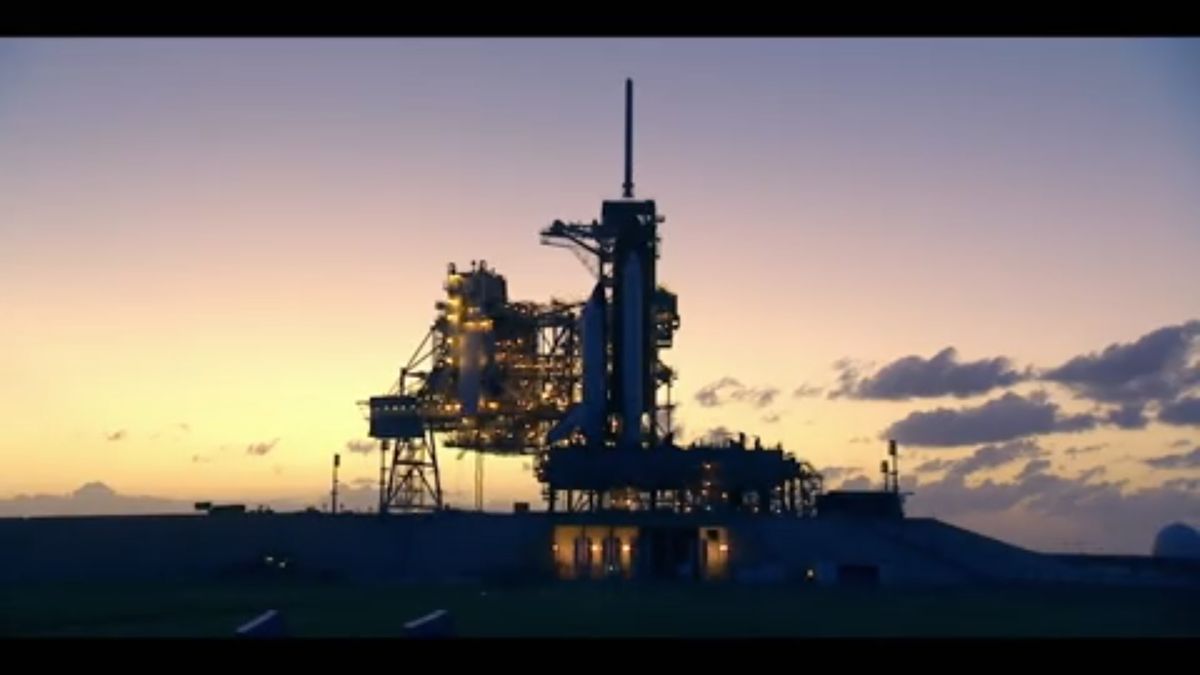 A space shuttle awaits launch on the launch pad