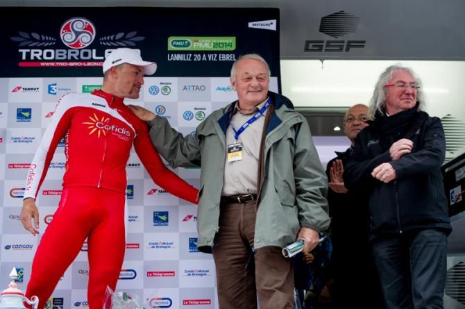 The former director of Tour de France, Mr. Jean-Marie Leblanc exchanges greetings with the winner