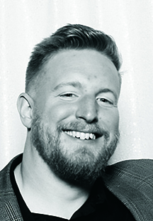 Artist headshot; a man with a beard