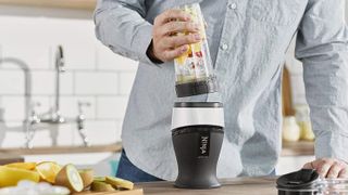 The Ninja QB3001 being used to make a smoothie