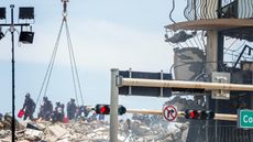 First responders searching debris for signs of life