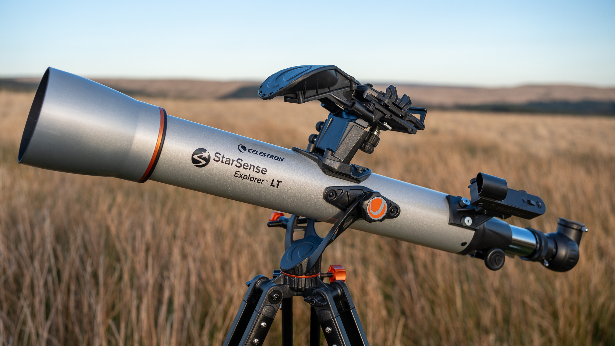 Celestron StarSense Explorer LT 70AZ set up in a field at dusk