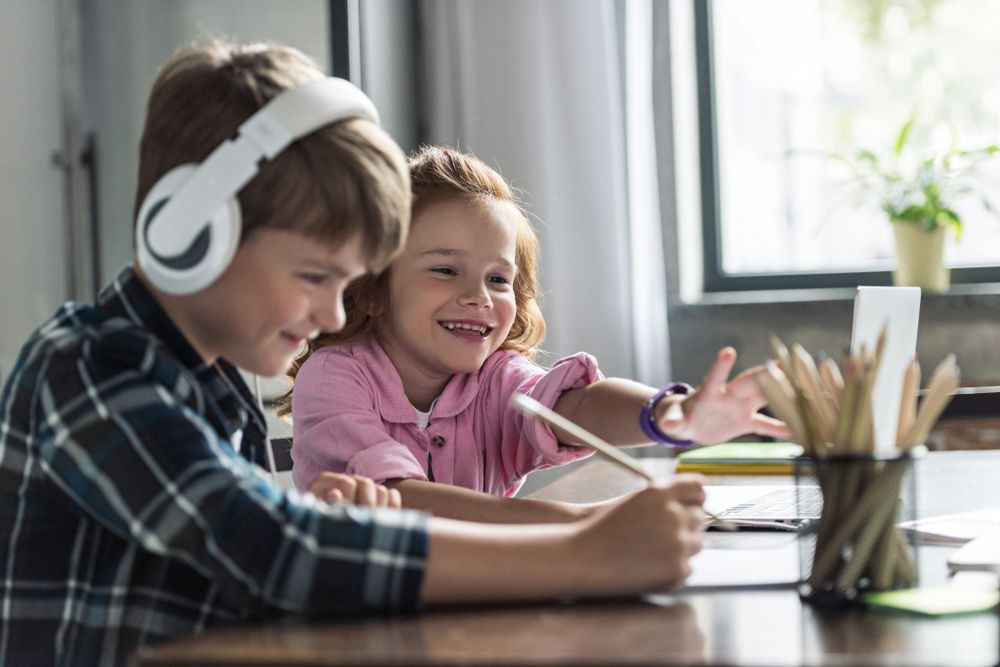 Kids learning at home via a laptop