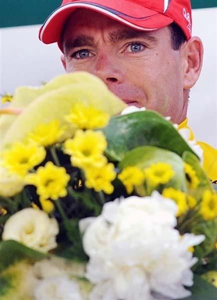 Cadel Evans (Silence-Lotto) on the podium with flowers.
