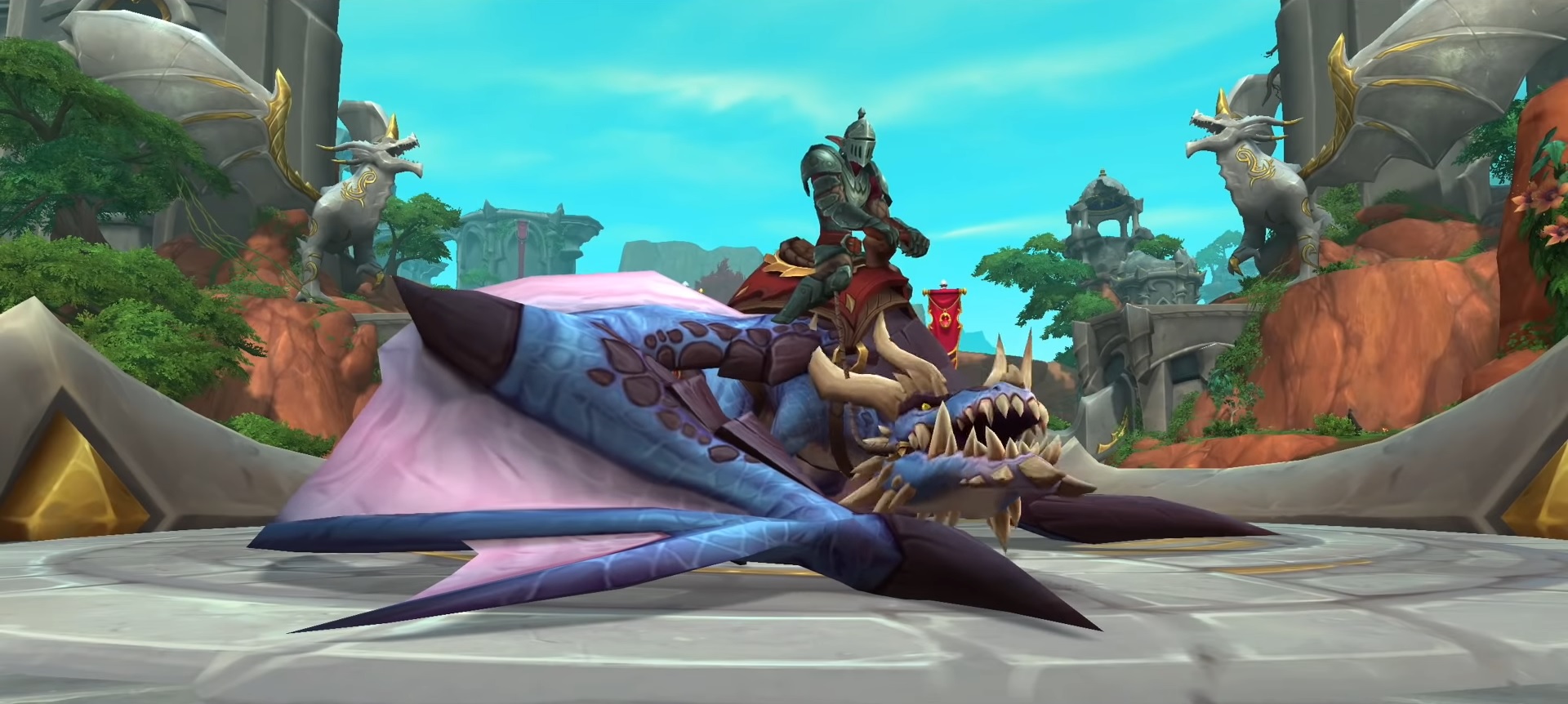 World of Warcraft: Dragonflight - A player in armor sits on top of a drake mount