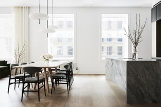 Dining and big windows at Union Square Loft redone by Worrell Yeung and Colony Design