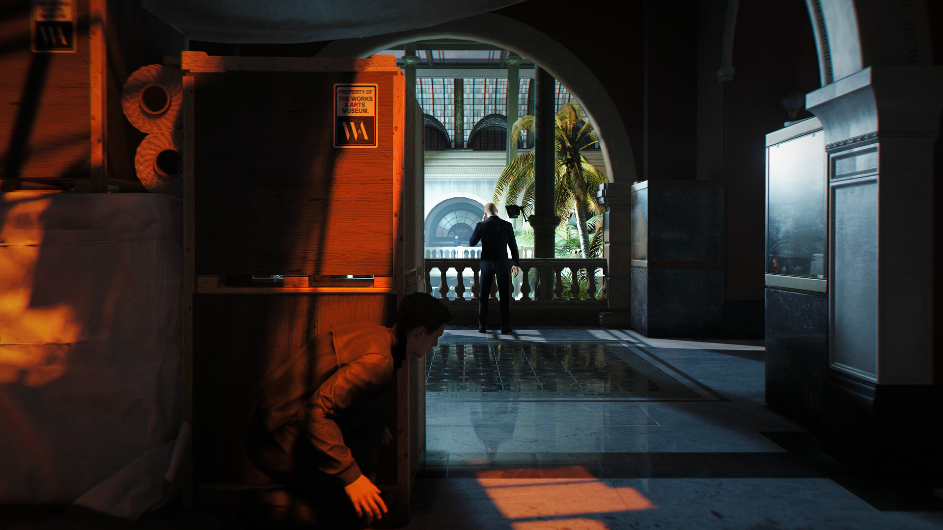 007 First Light screenshot showing James Bond crouched behind boxes in stealth