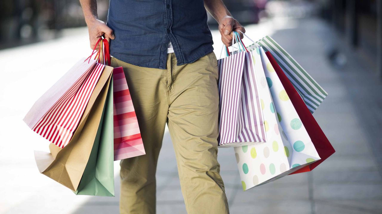 A man with lots of shopping bags