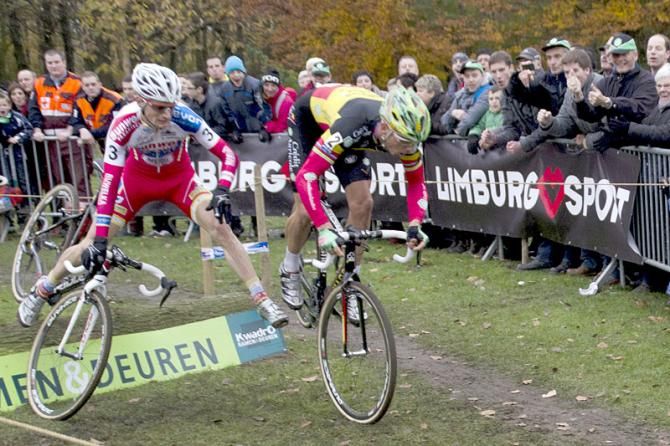 Sven Nys leads Kevin Pauwels over a barrier