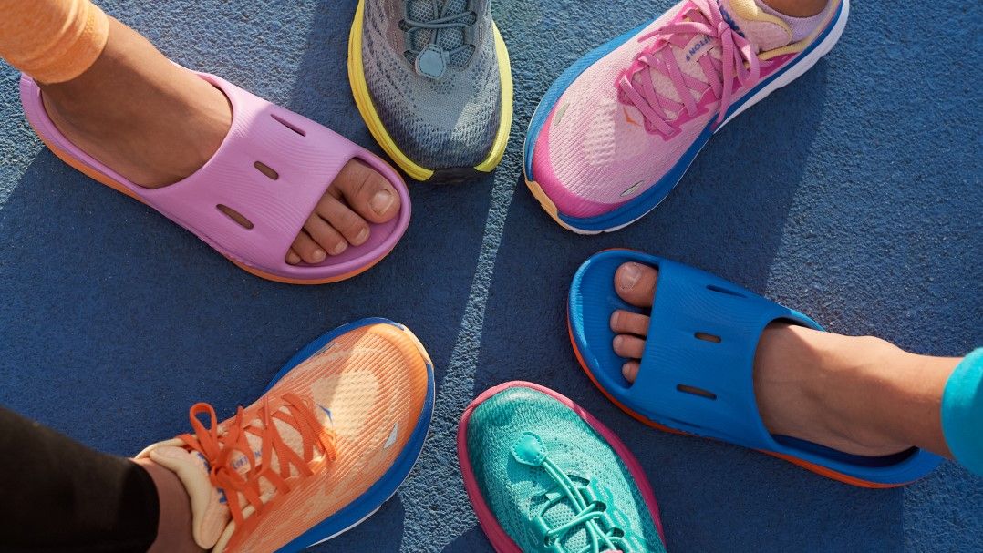 Children&#039;s feet wearing shoes from Hoka Kids Collection