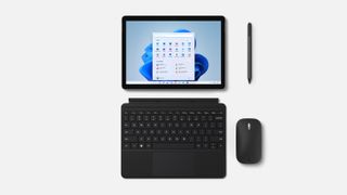 Microsoft Surface Pro 8 with detachable keyboard, stylus, and other accessories