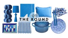 Cerulean home decor, including a vase, trinket dish, table lamp, tissue cover, tablecloth, Dutch oven, cushion cover, taper candles, dinner plate, and patterned napkins, pictured on a white background