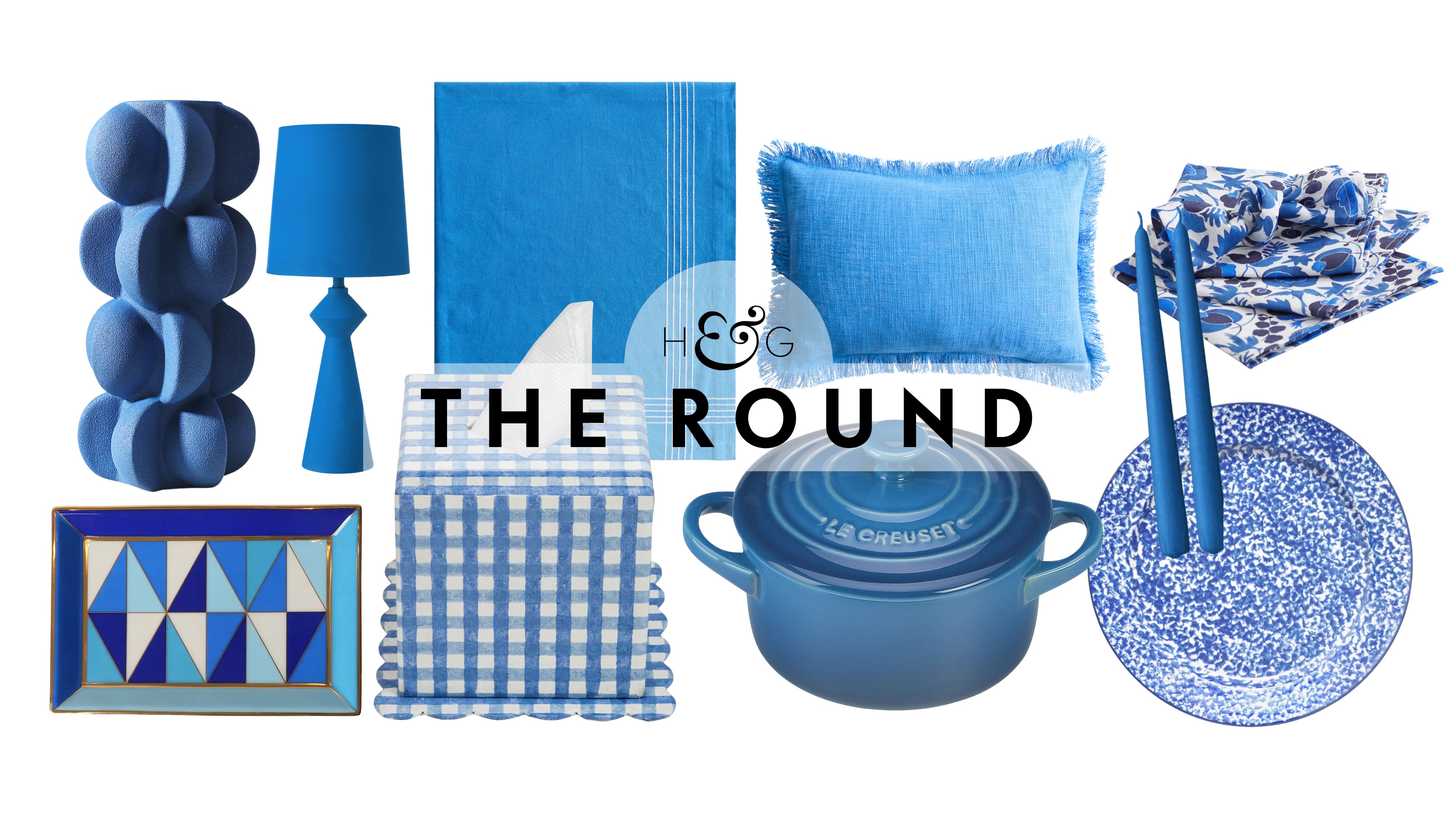 Cerulean home decor, including a vase, trinket dish, table lamp, tissue cover, tablecloth, Dutch oven, cushion cover, taper candles, dinner plate, and patterned napkins, pictured on a white background