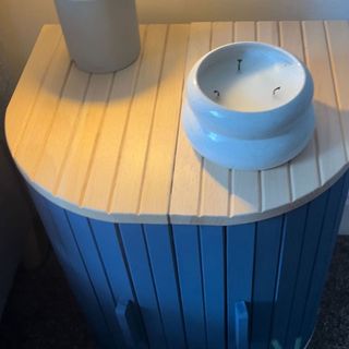 IKEA hack making a magasin bread bin into a bedside table with blue paint and gold legs