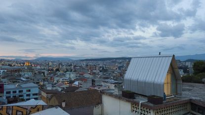 view of Quito city with tiny home Casa Parasito in the foreground