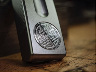 A close up of an Olson Golf black putter