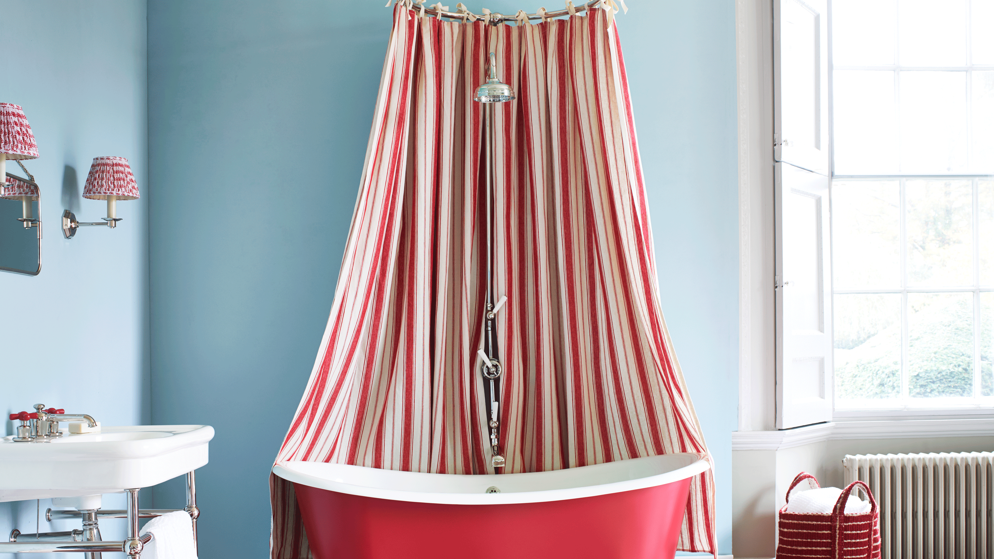 Red bath with red and white striped shower curtain