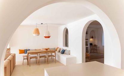 Room with arched doorway and ceiling lamps