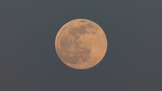 a bright full moon in the sky