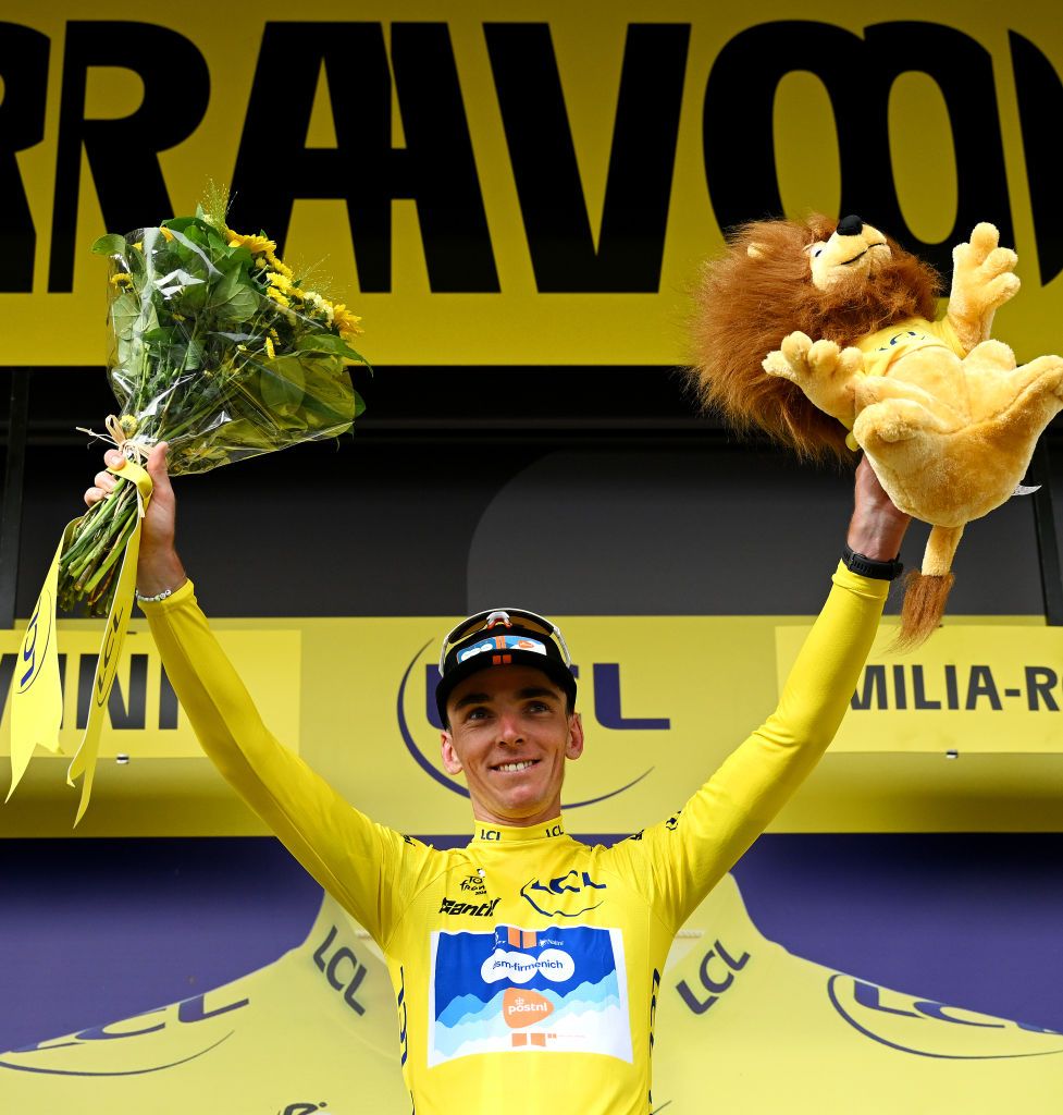 Tour de France: Romain Bardet of France and Team dsmfirmenich PostNL celebrates at podium as Yellow Leader Jersey winner during the 111th Tour de France 2024 Stage 1 a 206km stage from Firenze to Rimini UCIWT on June 29 2024 in Rimini Italy Photo by Dario BelingheriGetty Images