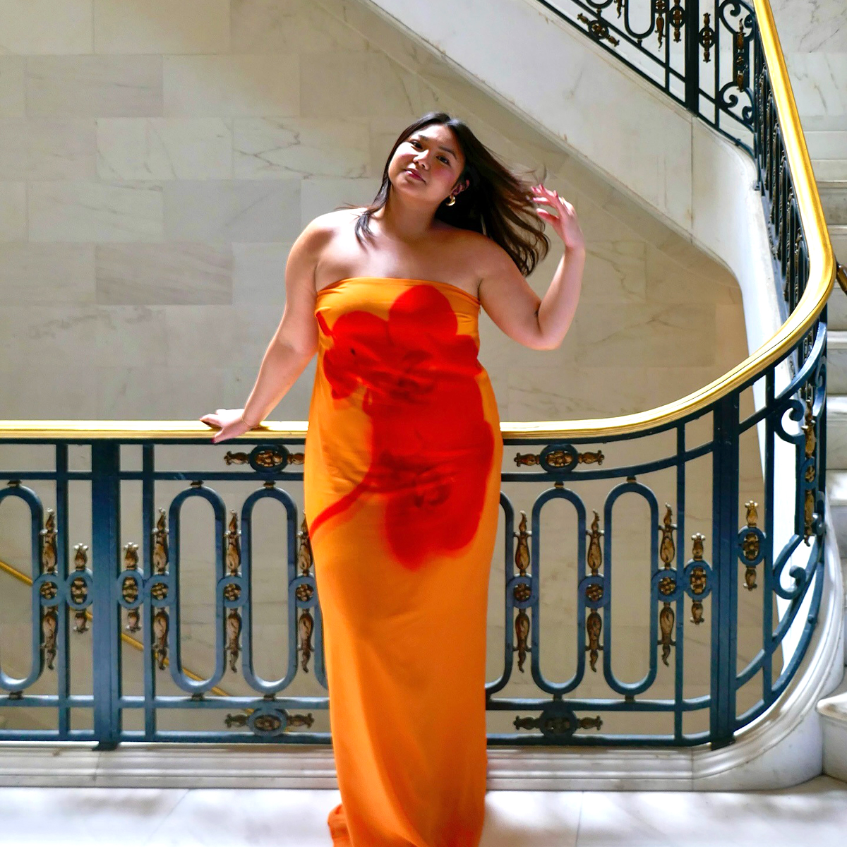 Influencer Marina Torres wearing a Meshki floral dress. 