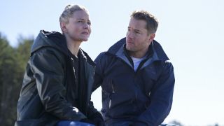 Jennifer Morrison and Justin Hartley sitting together in CBS' Tracker Season 1 finale