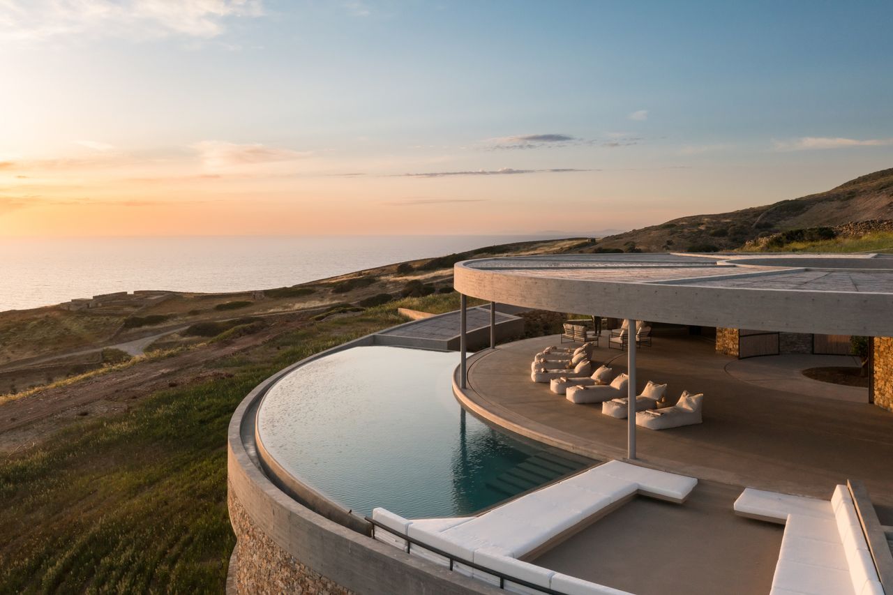 Exterior view of a circular home with view of the sea