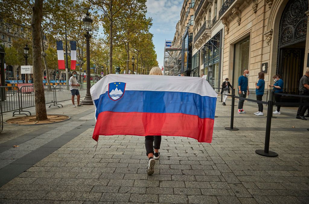PARIS FRANCE SEPTEMBER 20 A Slovenian cycle fan walks up the Champs Elysees as fans arrive to watch the final stage of the Tour de France and see their compatriot Tadej Pogacar win this years Tour on September 20 2020 in Paris France The Tour de France first organised in 1903 is an annual 23day mens bicycle race Due to the coronavirus pandemic teams have been kept in isolated bubbles which has managed to secure no riders contracting the virus during the tour Photo by Kiran RidleyGetty Images