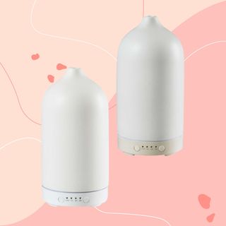 White electric diffusers against pink background