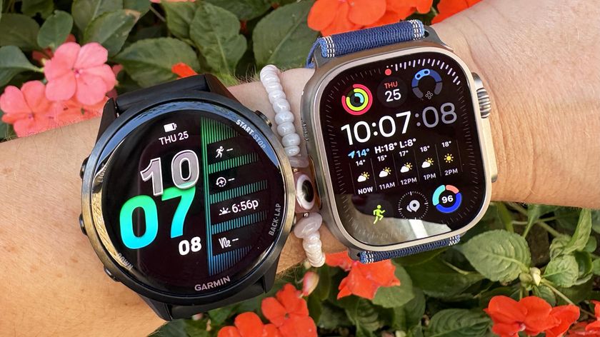 Garmin Forerunner 970 and Apple Watch Ultra 3 on wrist