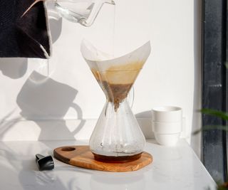 A pour-over coffee maker with the filter sat in the cone