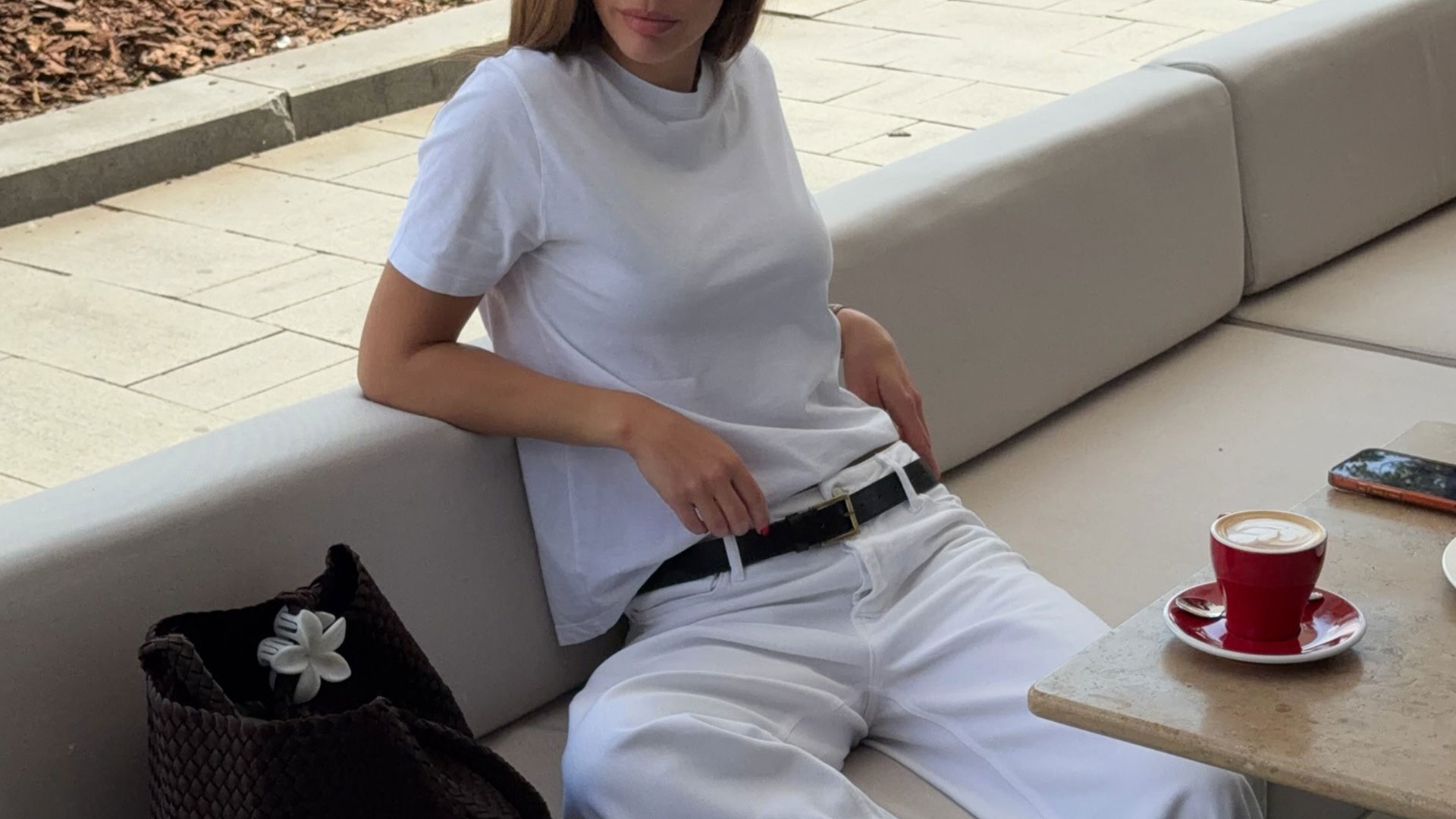 @by_eva_ outfit closeup in white tee and white jeans with black belt.