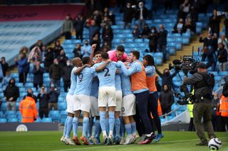 Manchester City players mob Sergio Aguero after his first goal