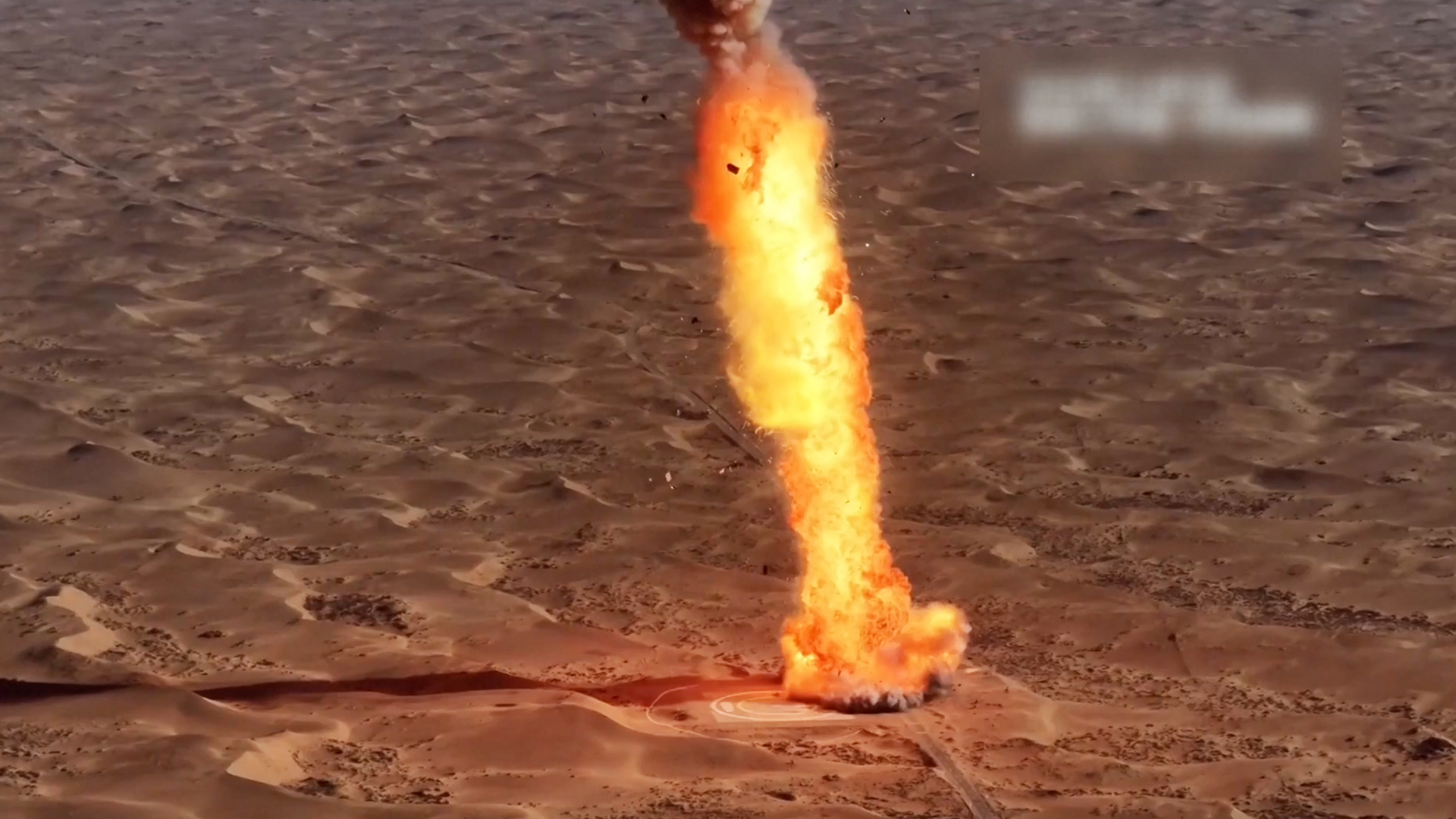 photo showing a rocket crashing into a desert landspace, creating a massive fireball