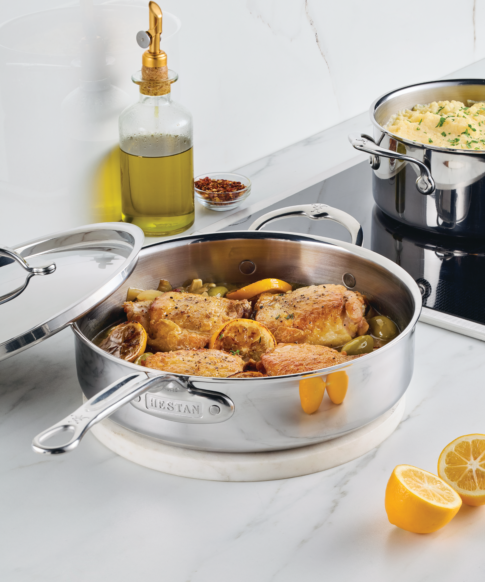 Hestan Probond Luxe pan with chicken thighs in olive and lemon sauce
