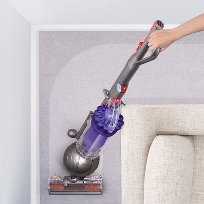 Room with upright Dyson vacuum cleaner