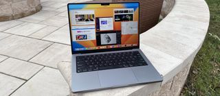MacBook Pro 14-inch 2023 on wall