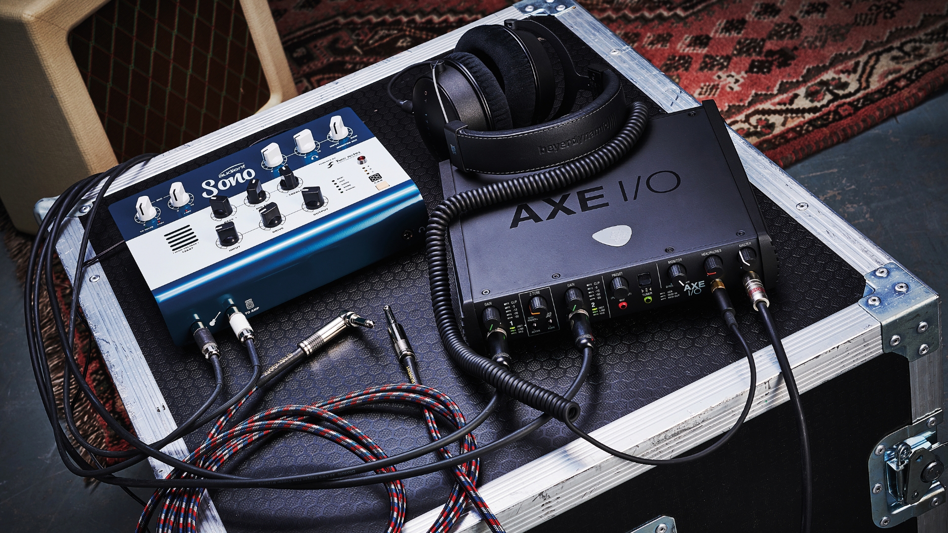 An audio interface on a flight case with a guitar pedal