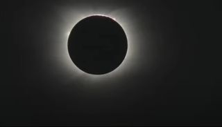 The moon passes in front of the sun in the only total solar eclipse of 2021 in this still from a video captured by Theo Boris and Christian Lockwood of the JM Pasachoff Antarctic Expedition from their observing point in Union Glacier, Antarctica on Dec. 4, 2021. 